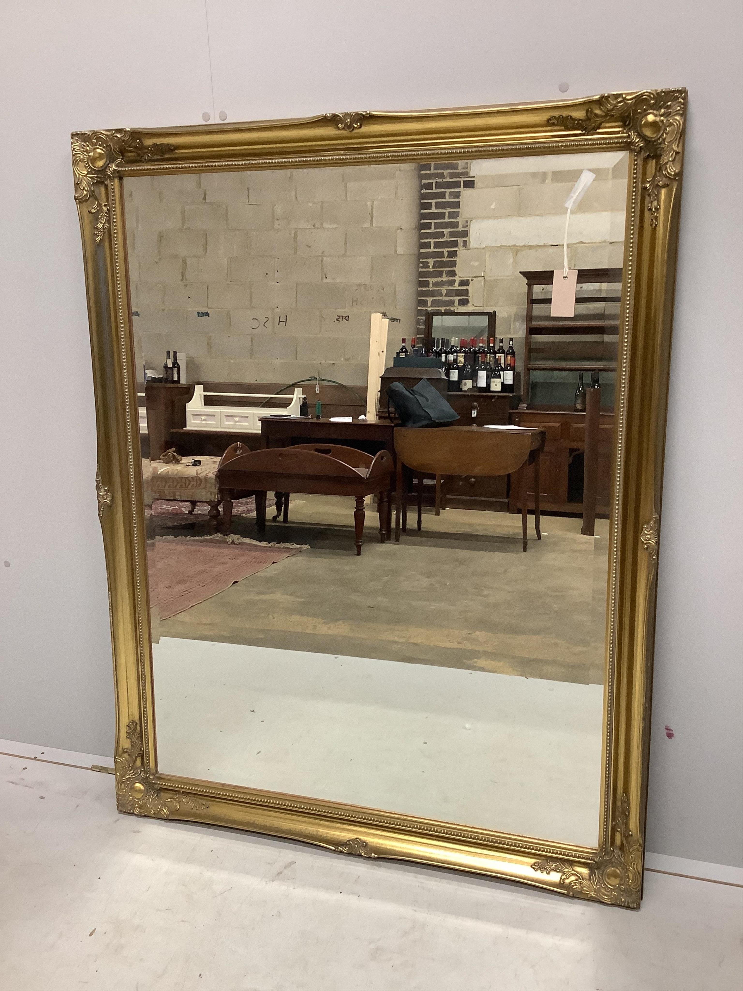 Two Victorian style gilt framed overmantel mirrors, larger width 102cm, height 132cm. Condition - good